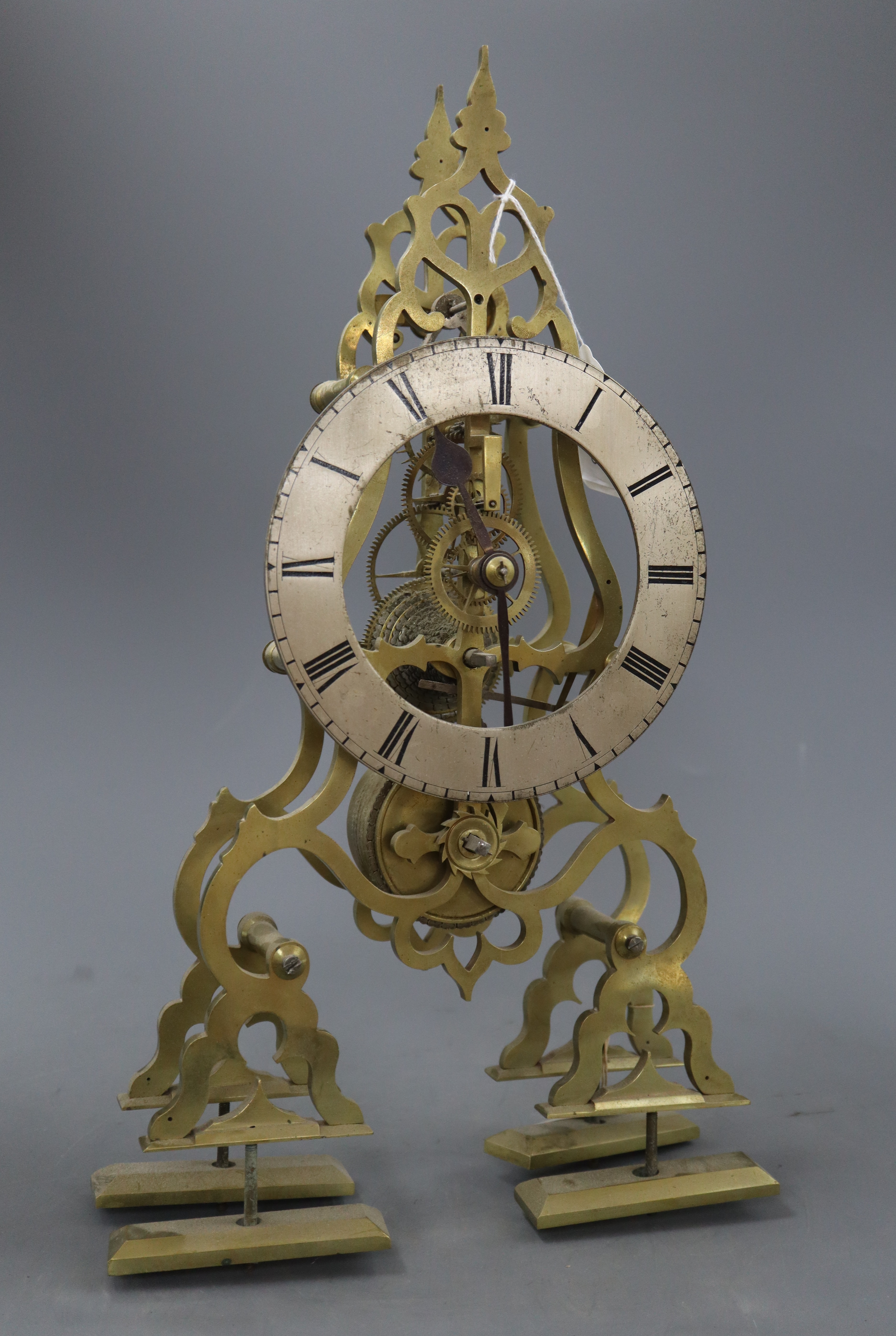 A late 19th / early 20th century brass skeleton clock, with single chain fusee movement, lacking pendulum and base, H.42.5cm